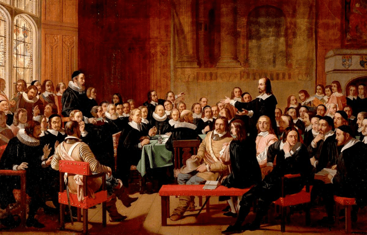 Oil on canvas painting of a scene in the Westminster Assembly of Divines, 1644. The room is filled with theologians and Members of Parliament, who are mostly sat down and divided on either side of the room. On the right, Philip Nye is depicted stood up and delivering his controversial speech against the Presbyterian Church.