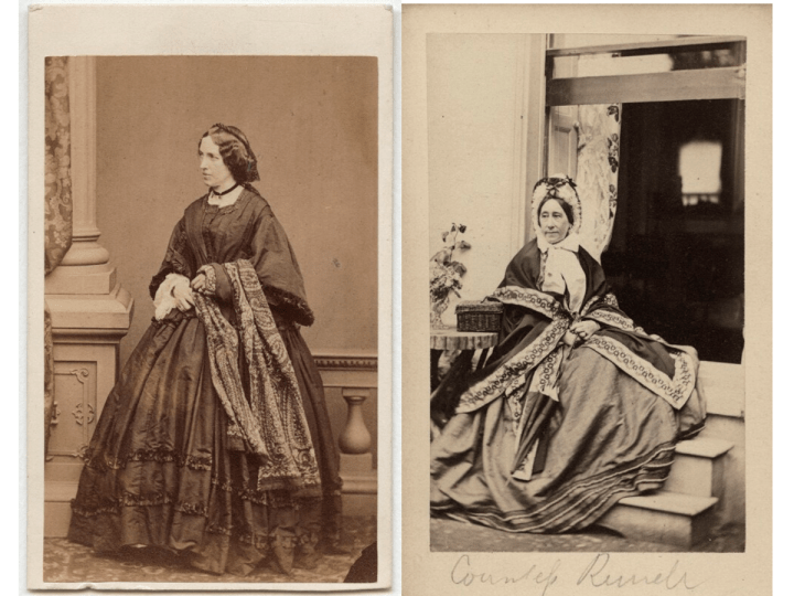 Two early photographic full-length portraits of two women. The left picture, a women is standing in a long black wide dress with a patterned scarf over her left arm. She is wearing a tight black necklace, he hair is black and is neatly wavy with a plat placed over the crown of her head. The right picture, a woman is sitting on a set of steps leading up to an open window. Shes is wearing a grey dress with a patterned shawl over her shoulders. She is wearing a frilled bonnet tied with a wide white piece of fabric under her chin. There is a small woven wooden basket to her left on a small table. 